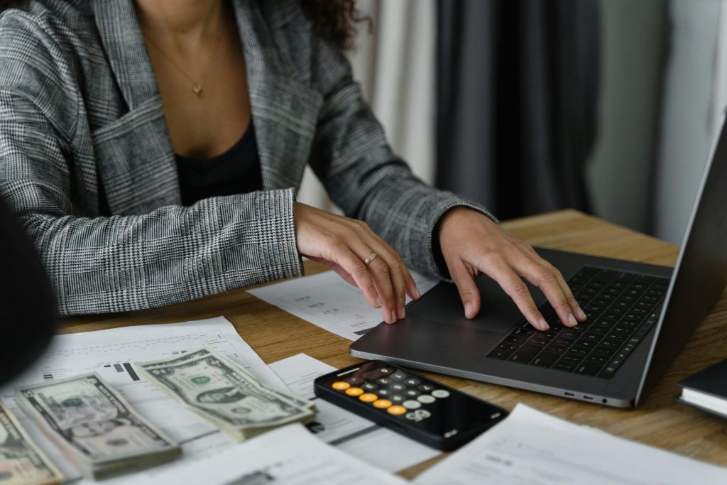 female using computer and paying bills